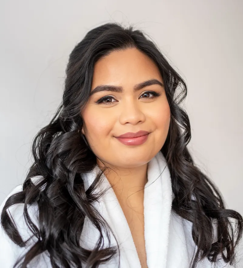 Smiling bridal glam in a robe